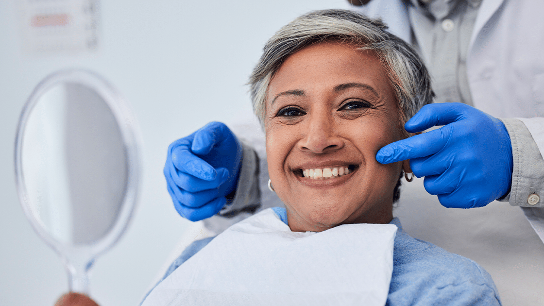 Woman Smiling With Mirror